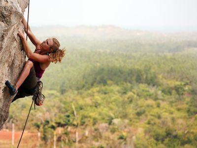 woman rock climbing