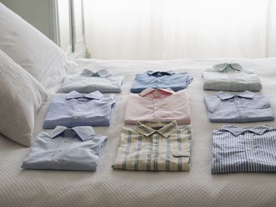 Clean shirts ordered on a bed