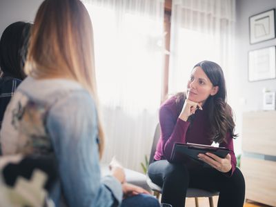 Female psychologist listening to patients