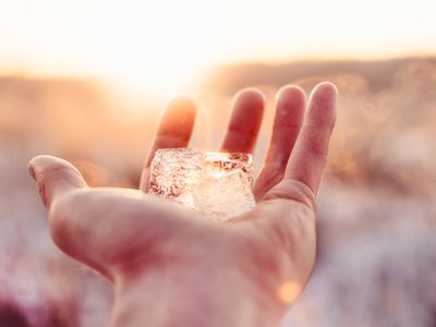 Cropped Hand Of Person Holding Ice