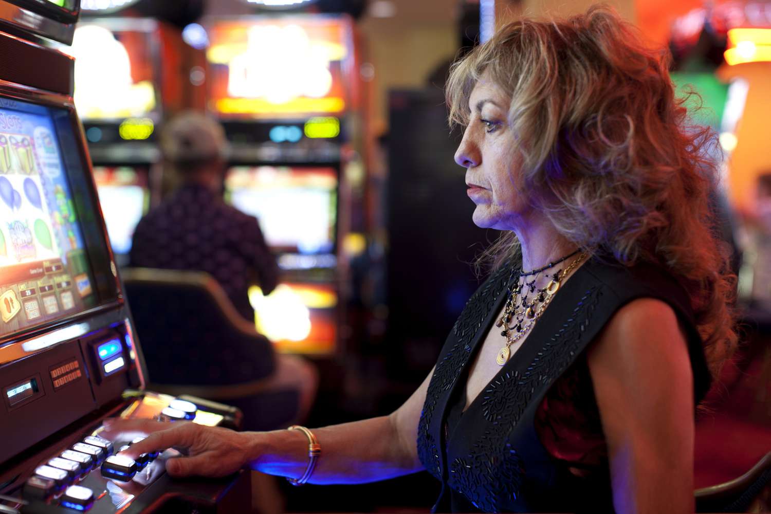 Woman using slot machine