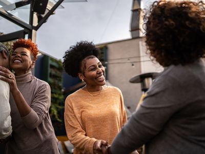 Woman greeting friends