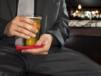 Hands of man holding beer