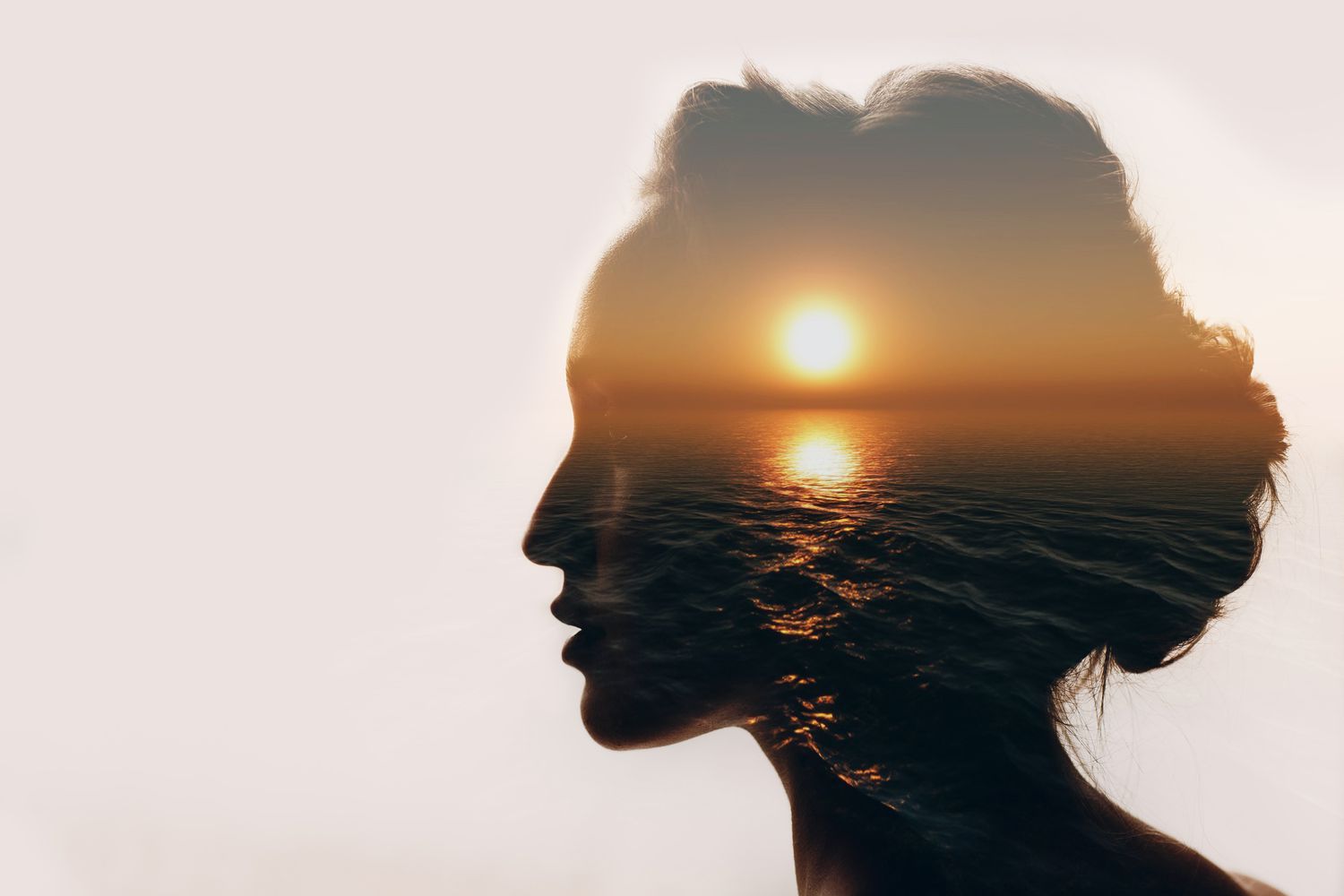 Sunrise and woman silhouette.