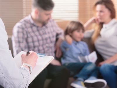 Family with child visiting a psychologist.