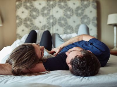 Shot of a happy young couple sharing a romantic moment in the bedroom at home