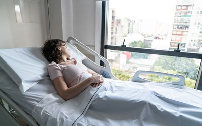 Woman in hospital bed