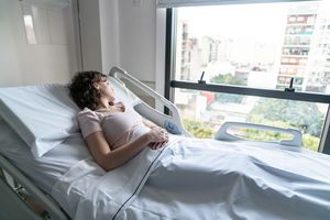 Woman in hospital bed