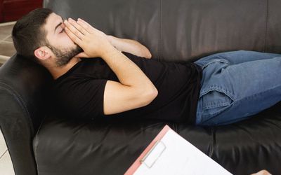 young man talking to a therapist