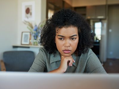 Woman paying close attention to some online data