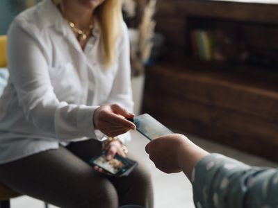 Two women communicating. Psychological consultation using metaphorical cards.