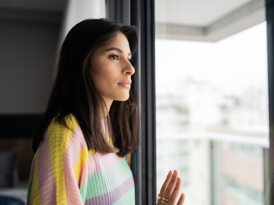 Young woman contemplating at home