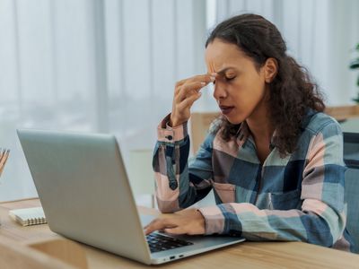 person stressed out at their computer