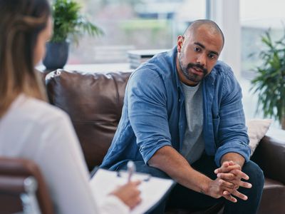 male patient talking to his therapist