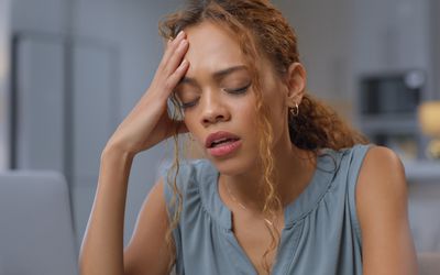 person stressed and sad at desk