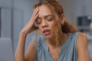 person stressed and sad at desk