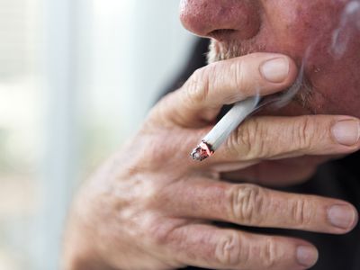 Close up of a man smoking a cigarette 