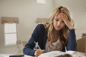 Woman reading, looking stressed