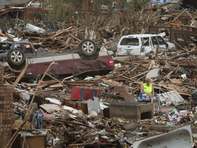 woman in aftermath of a tornado