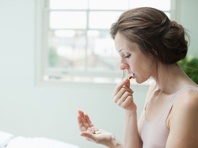 woman taking medication