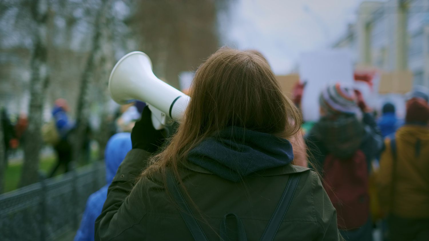 Young woman at demonstration in the city.