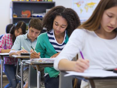 high school students working at their desks at school