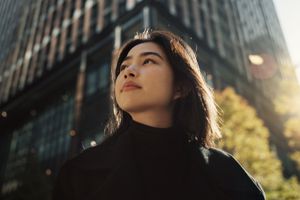 woman walking around a city in the daytime