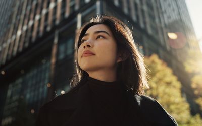 woman walking around a city in the daytime