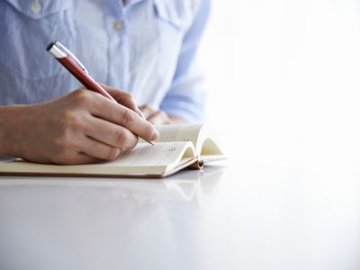 Woman writing in journal