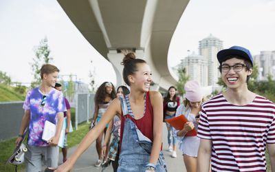 teenagers laughing and walking