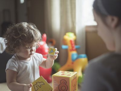 a baby playing with toys