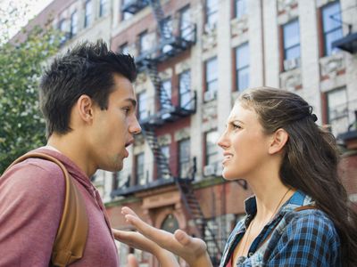 Young couple having an argument outside