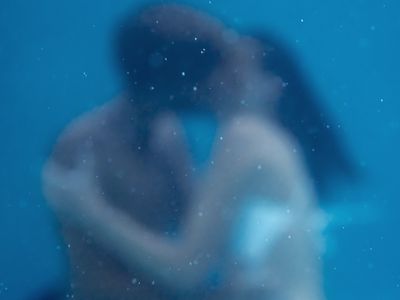 Soft Focus photo of young couple kissing, embracing under water, Underwater love, together forever, Falling in Love