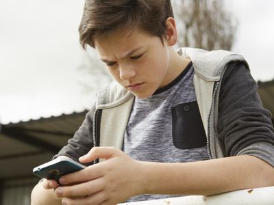 anxious boy on phone