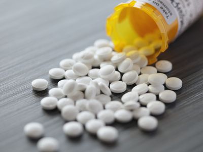 white pills spilled out on table