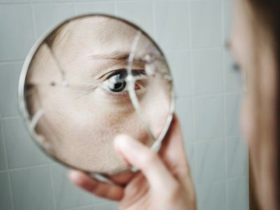 Woman looking in mirror