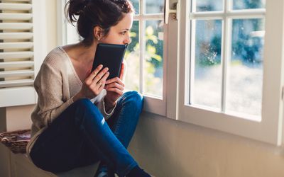 woman looking out window