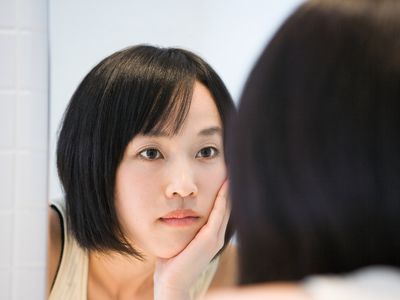 Woman looking in the mirror