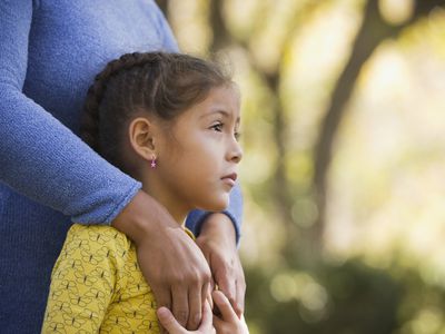 woman hugging daughter