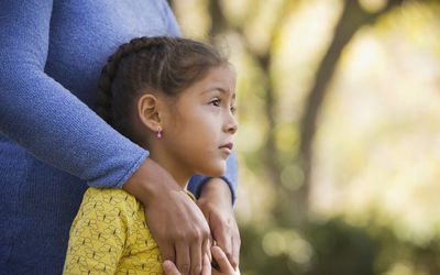 woman hugging daughter