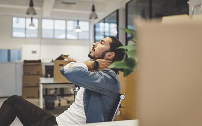 young businessman stressed while sitting in the office