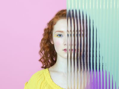 Girl behind plastic wall.