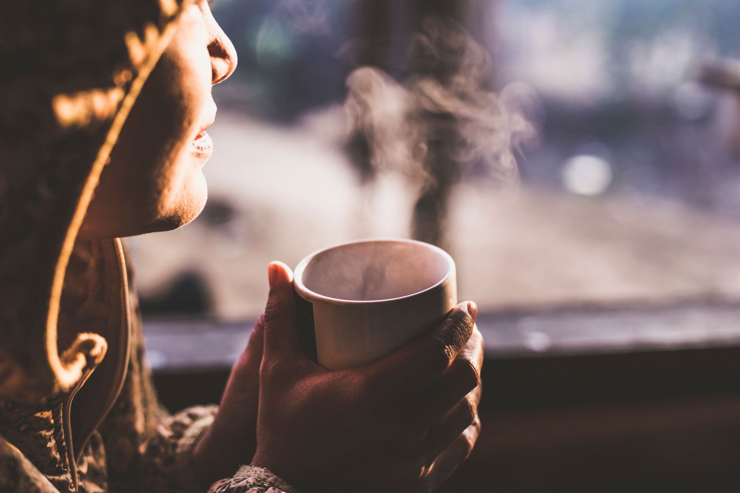 Woman Having coffee During Sunset