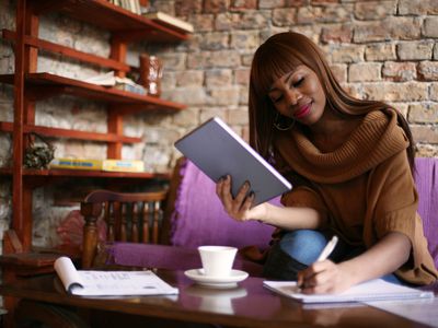 Woman writing in a notebook