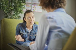 Young woman talking with a therapist