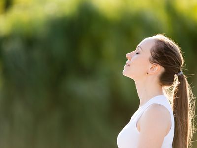 Sporty beautiful smiling young woman relaxing