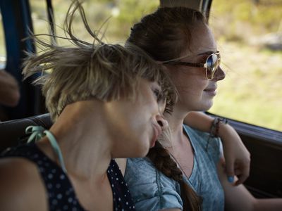 Good friends on a road trip in big old car