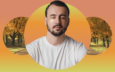 Man with undereye masks meditating against a fall backdrop