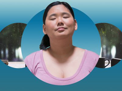 Woman closing her eye against a rainy window with mugs on the table