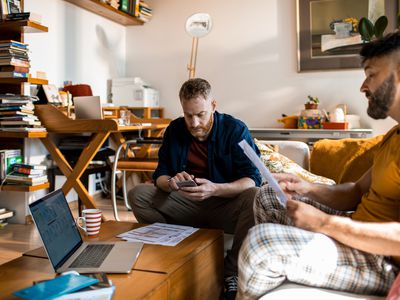 Male couple going over their home finances